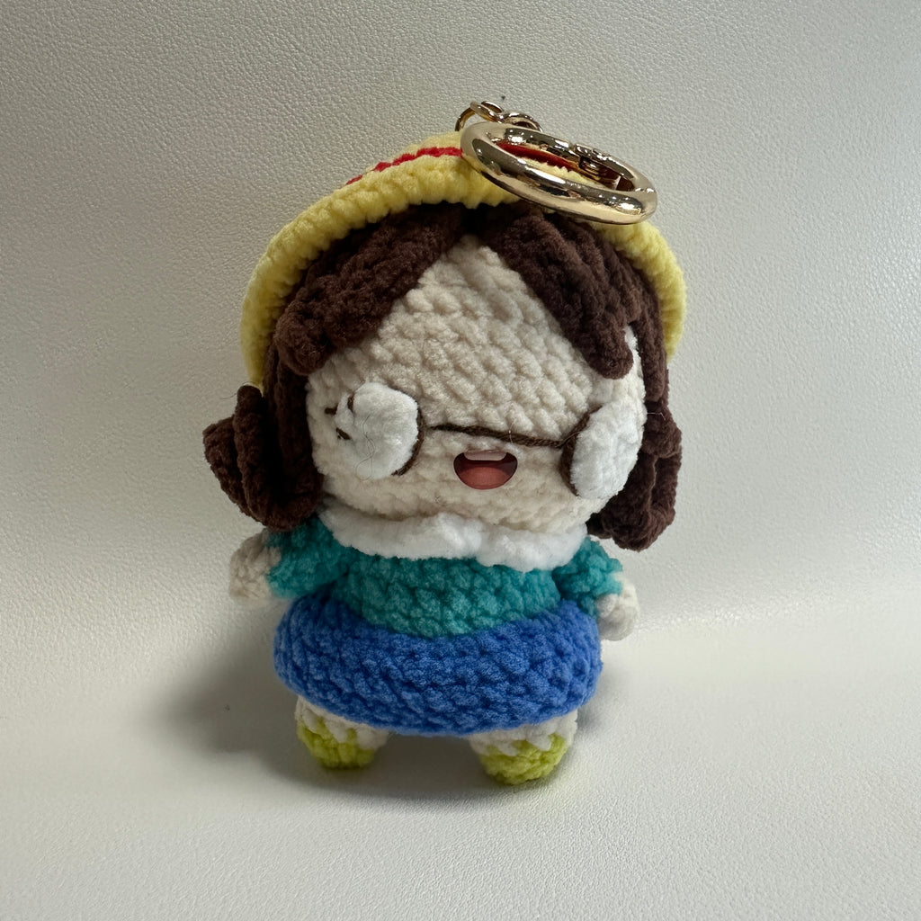 Handmade Crochet Girl Keychain – Glasses, Yellow Hat & Rainbow Sweater | 10cm Amigurumi Charm