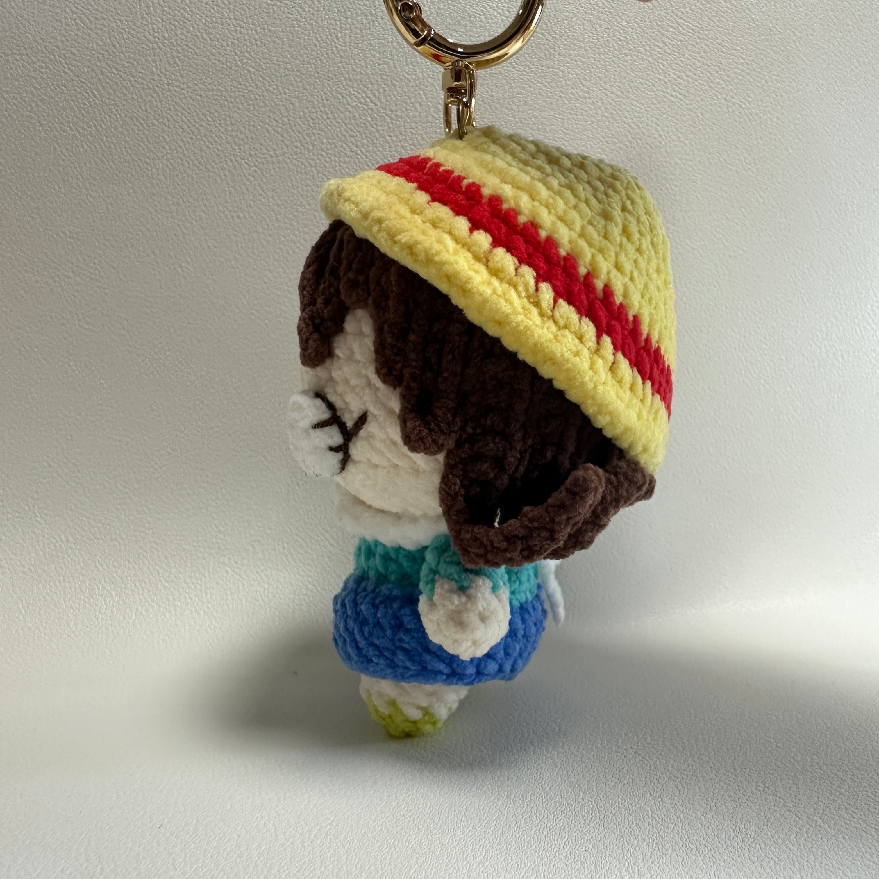 Handmade Crochet Girl Keychain – Glasses, Yellow Hat & Rainbow Sweater | 10cm Amigurumi Charm