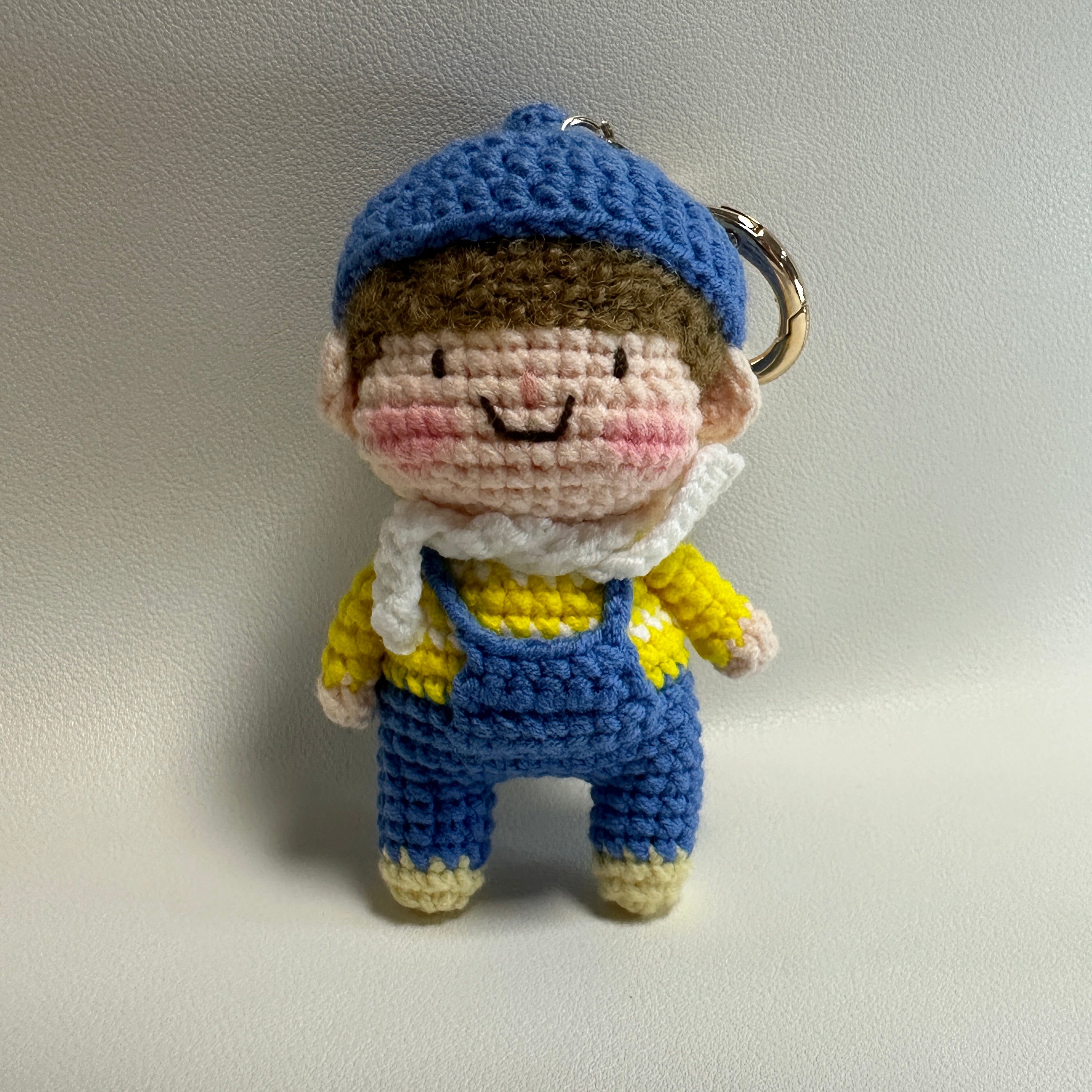 Handmade Crochet Boy Keychain – Blue Cap, Yellow Sweater & Denim Overalls | 10cm Amigurumi Charm