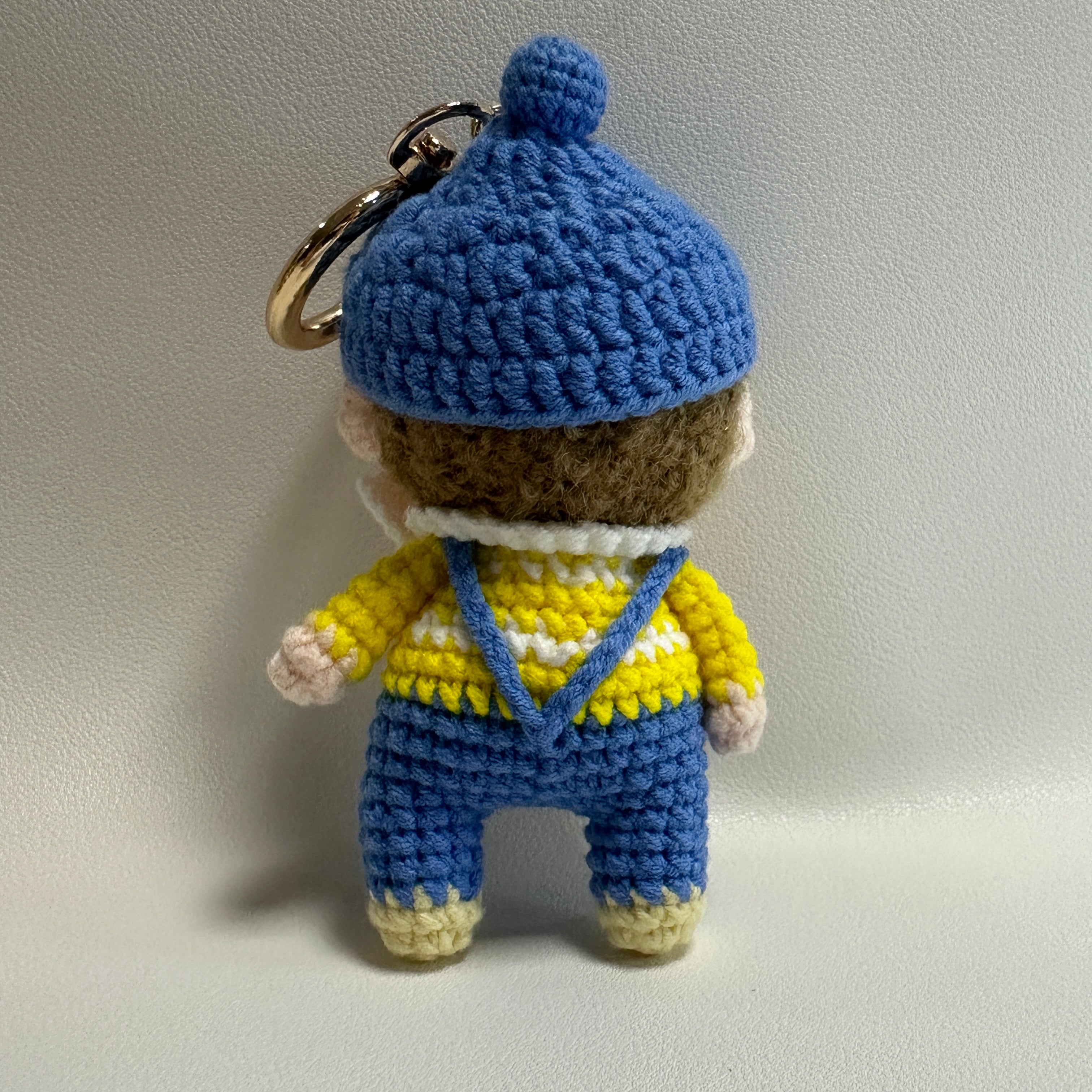 Handmade Crochet Boy Keychain – Blue Cap, Yellow Sweater & Denim Overalls | 10cm Amigurumi Charm